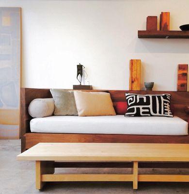 Studio vignette with Cocoon sofa in solid walnut and stringer coffee table in solid maple.