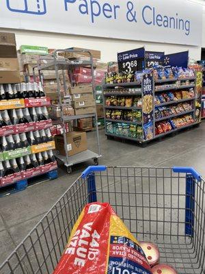 The "aisle" where customers should walk between cleaning supplies and beverages