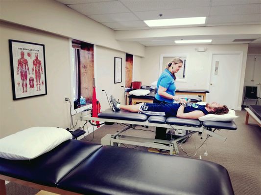 Therapist working with patient.