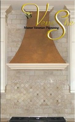 A range hood featuring a popular rustic Italian plaster finish