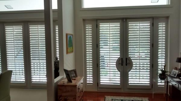 Painted wood shutters on front door. Olde Marsh residence. Palm Beach Gardens, Fl.