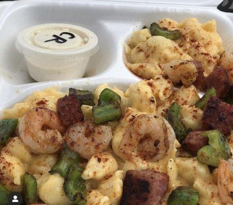 Shells and cheese with Cajun shrimp and kielbasa with Cajun ranch dressing! Tasty!