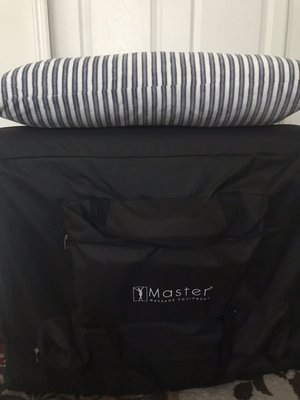 Massage table in its cover