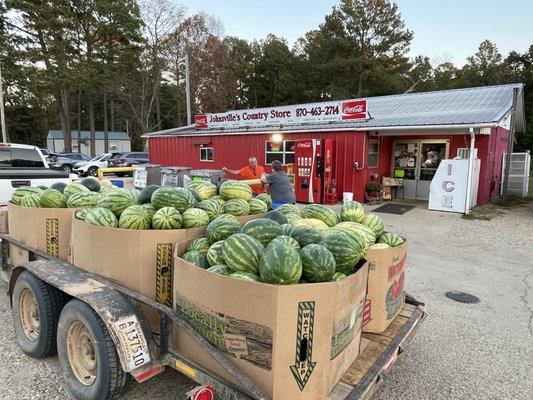 Watermelon vendors wagon parked in front of store. Yes, you can buy melons from the vendor on the spot.