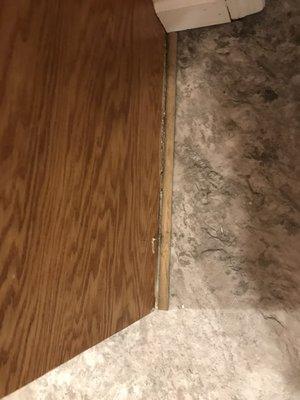 Shoe moulding was glued to the floor, not attached to woodworking