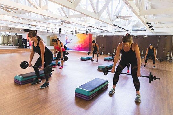 Body Pump class by Les Mills is one of our most popular classes. It's group strength training with barbells, plates, and a bench.