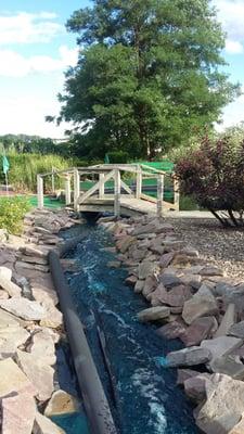 Nice landscaping  complete with the totally "natural" blue water.