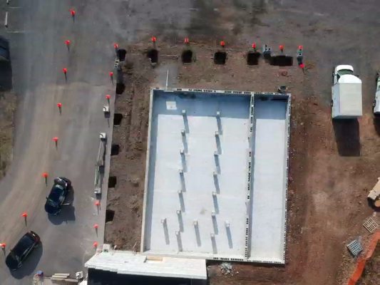 Walls and slab by others pier holes are dug for Warwick farm brewing's tasting room