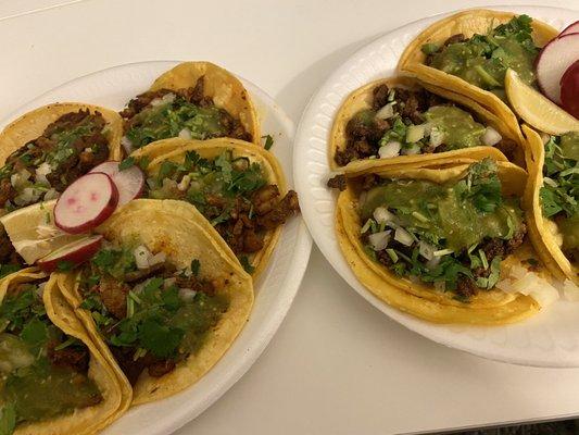 Tacos of Alpastor (left) and Asada (right) with green salsa.