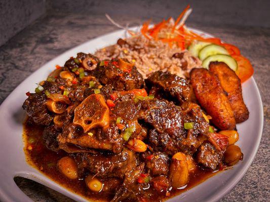 Oxtail with Rice & Peas Sun Salad and Fried Ripe Plantain.