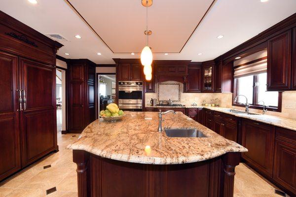 Custom stained cherry cabinetry with granite counter tops.