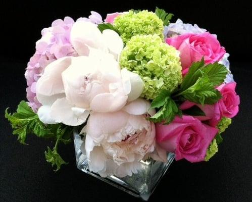 Spring arrangement with roses, hydrangeas and other spring time flower