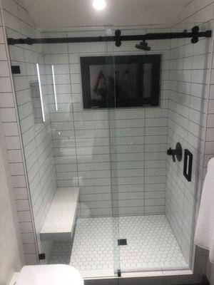 A barn-style frame-less shower we installed!