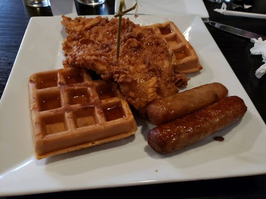 Fried Chicken and Waffles with sausages on the side.