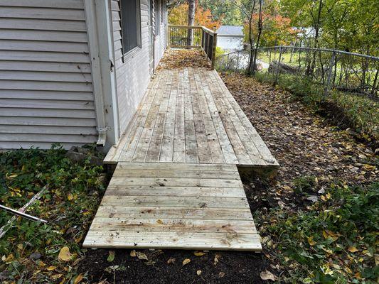 A deck with a wheel chair ramp