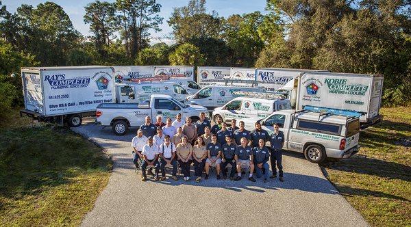 The staff at Ray's Complete Plumbing and Kobie Complete Heating & Cooling, with our fleet of service vehicles.