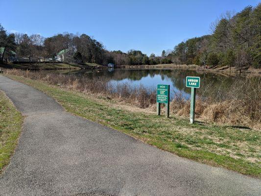 Walking trail by Arbor Lake looking towards fishing pier.