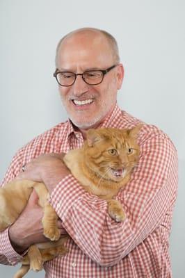 Dr. Schoolmeester with his spoiled cat Marmalade.