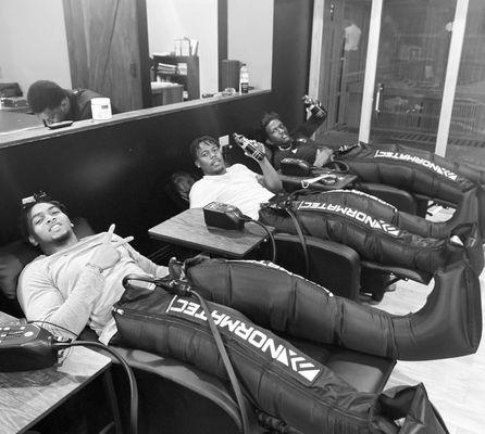 Tampa athletes relaxing with compression therapy