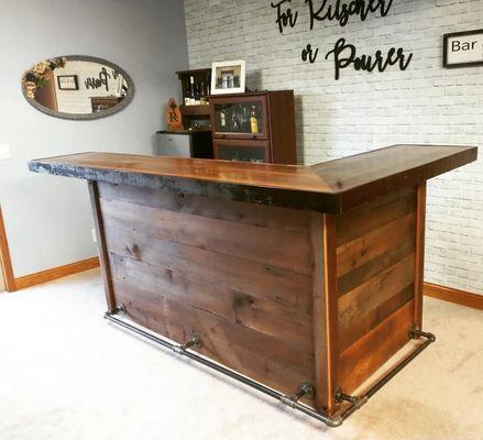 A custom basement bar from one hundred year old barn wood.