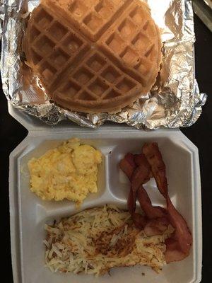 Eggs, bacon, hash browns, and waffle