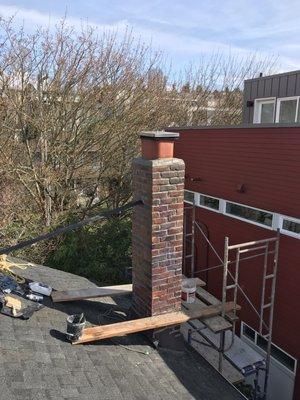 Chimney repair, tuck pointing, apply sealer for waterproof.