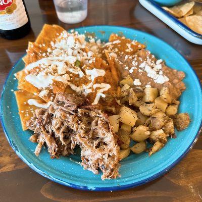 Red chilaquiles with carnitas