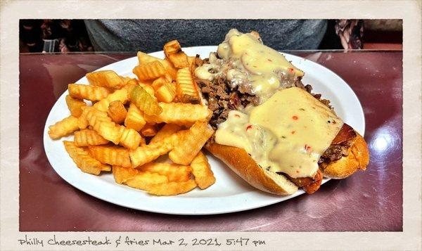 Philly cheesesteak and fries