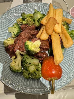 Steak tip dinner with fries and sautéed broccoli