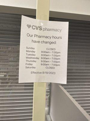 Store hours posted on shuttered pharmacy.