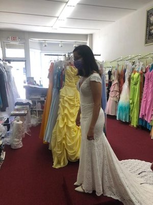 Second fitting, in the shop. At this point, she had taken the dress in too much and I could barely move my arms.