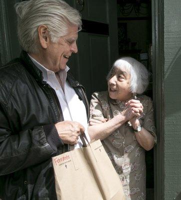 Member volunteers deliver meals to seniors in need.