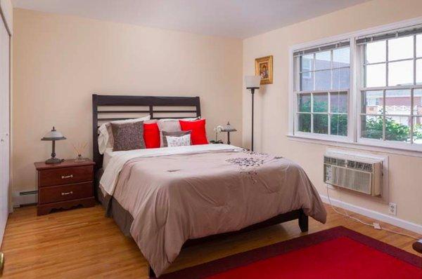 Bedrooms have large windows to let in natural light.