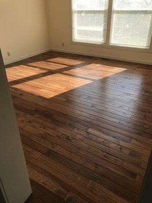 This client chose a solid hardwood floor by Great Lakes Flooring. Hickory Saddle has warm brown tones and a distinctive grain pattern.