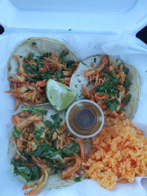 Chicken tacos with rice.