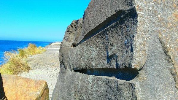 These grooves indicate where this 25 ton stone was split-off when being quarried.