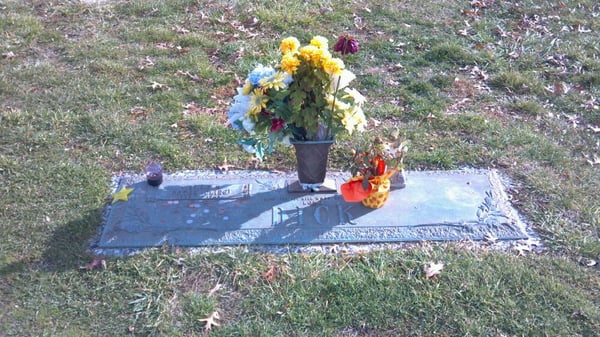 The burial site of music legend Patsy Cline. She is directly behind the funeral home a few feet from the road near the tree.