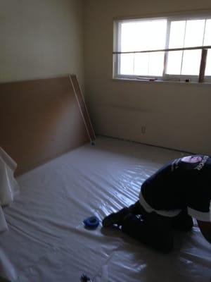 #1 Prepping the bedroom before removing the mold from the wall in back.