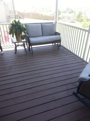 Inside newly re-screened in porch with painted decking.