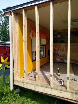 Complete rebuild of wall, removing studs, floor, ceiling, underlayment.