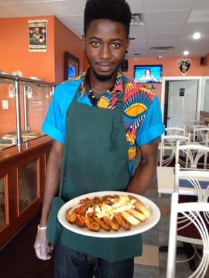 Friendly staff with my yams, plantains and smoked turkey.