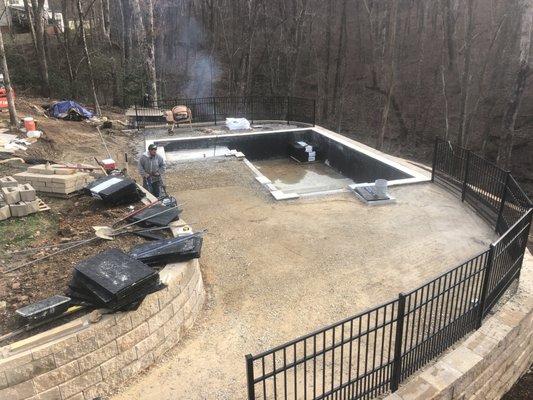 In progress of 3 retaining walls and Travertine pool deck