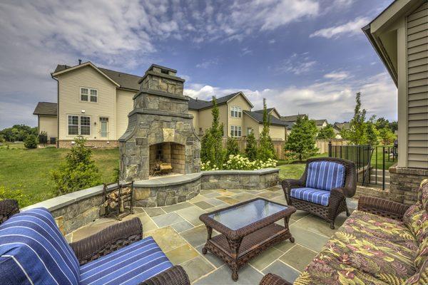 Wood burning fireplace and patio with classy curves.