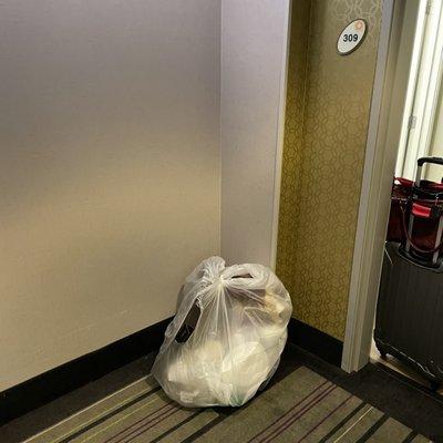 Large bags of trash found outside my hotel room