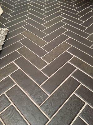 Tile Bathroom Floor in a  Herringbone Pattern