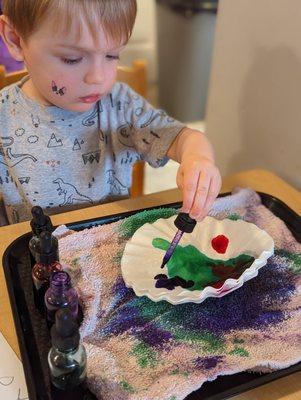 Strengthening small motor and creativity skills with an eye dropper art project