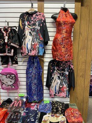 Qipao in a anime store next to BTS Kpop posters, seemed like cultural appropriation