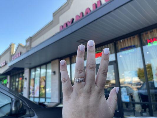 Nails in front of their salon