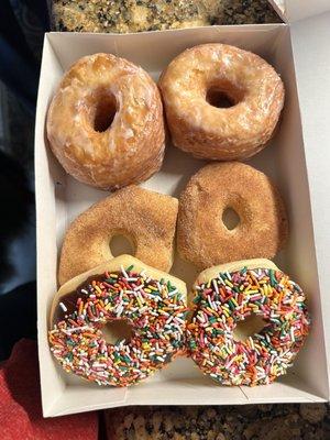 cronuts, cinnamon sugar donuts and chocolate sprinkle donuts