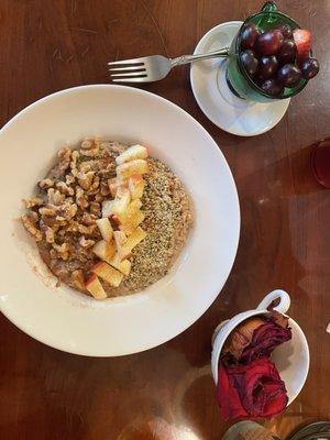 A delicious gluten free vegan oat meal with fruit, walnuts, and hemp seeds.